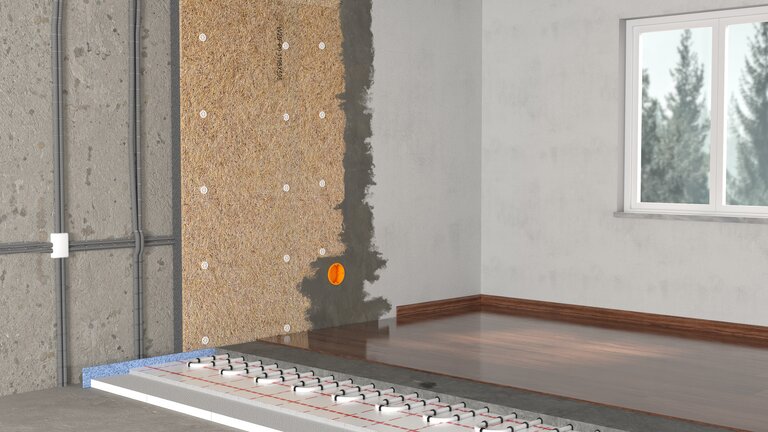 Wanddämmung und Fußbodenheizung im Querschnitt.